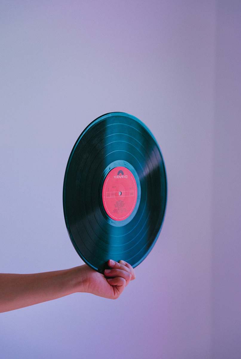kobu agency person holding vinyl record faro